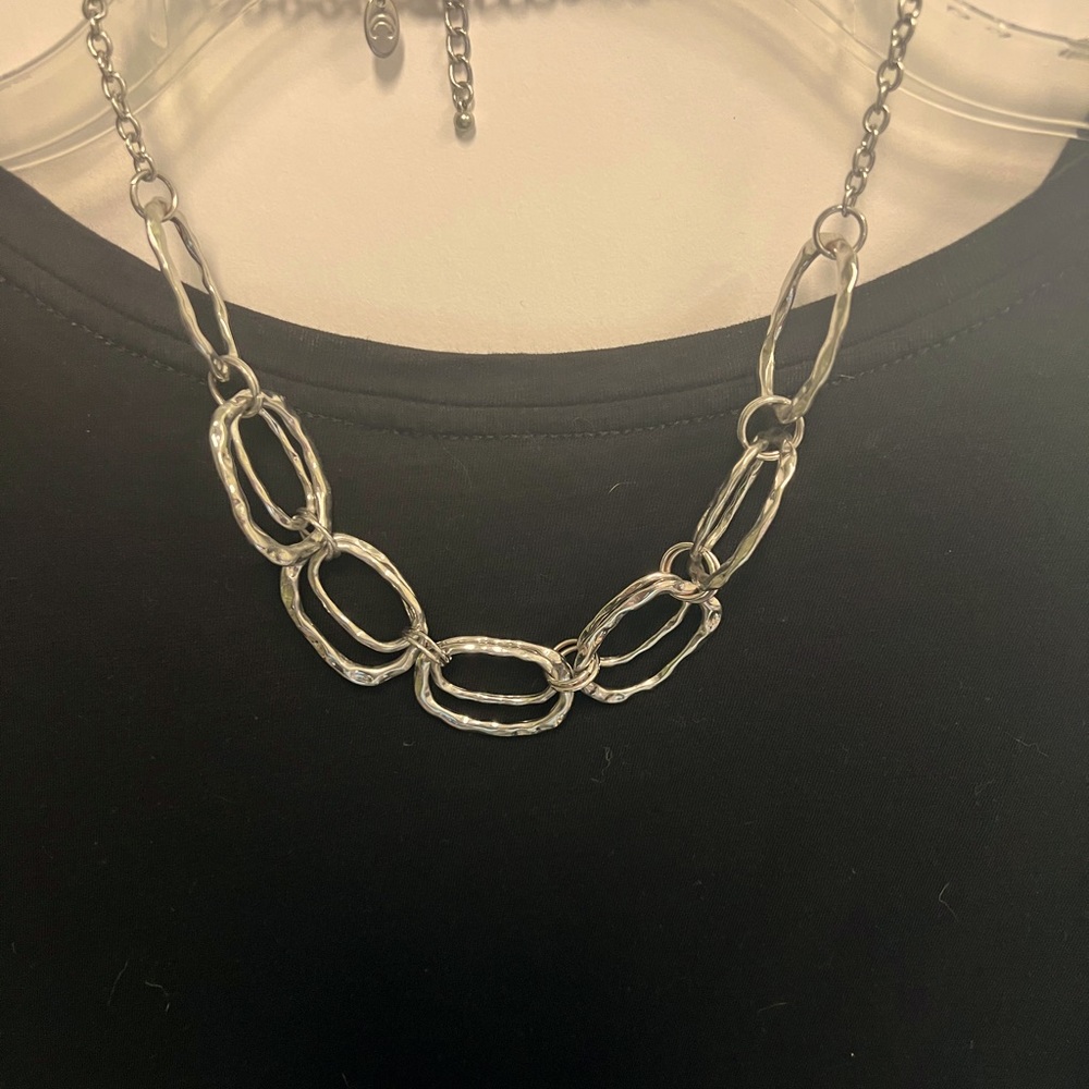 Silver colored costume necklace. Listing is for necklace only.